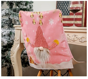 Detailed view of pink Christmas chair cover featuring a 3D gnome with LED sequins