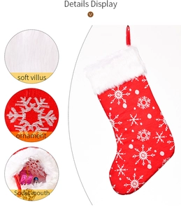 Detail showing soft white plush cuff and embroidered snowflake pattern on red Christmas sock
