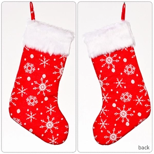 Detail view showing the front and back of red Christmas stockings with snowflake embroidery