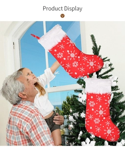 Detail of red Christmas stockings with white snowflake embroidery and plush faux fur trim
