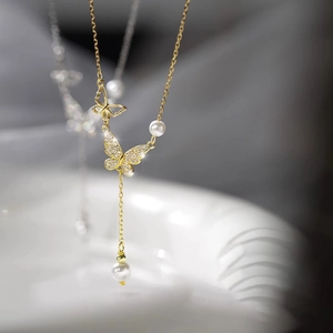 Elegant gold butterfly necklace with shimmering pearls and zircon inlay for women