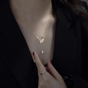 Elegant gold butterfly necklace for women with sparkling crystals and pearl pendant