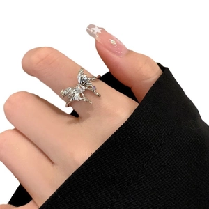 Adjustable silver butterfly ring with purple zircon crystals and pleated wing texture