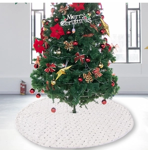 Detail of white faux fur Christmas tree skirt with silver sequins and diamond pattern
