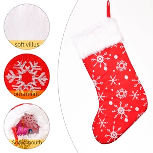 Red Christmas stocking with white snowflake embroidery and soft faux fur cuff detail