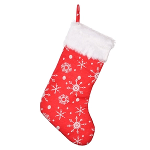 Red Christmas stocking with embroidered white snowflakes and fluffy faux fur trim detail