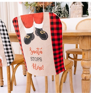 Detail of Christmas chair cover with Santa STOPS Here print on plaid burlap fabric