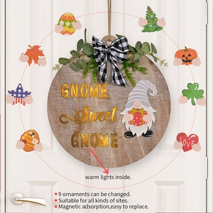 Detail of a round wooden door sign with magnetic accessories for different holidays