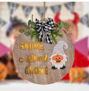 Detail of wooden Halloween gnome door sign with GNOME Sweet GNOME text and pumpkin