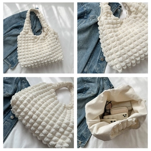 Detailed views of white bubble textured tote bag showing pleated fabric and large capacity