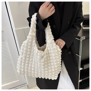 Detailed texture of white bubble cloud tote bag showing ruffled 3D fabric and handle