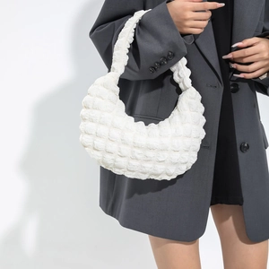 Modern white crescent moon shoulder bag with unique bubble textured fabric and minimalist design