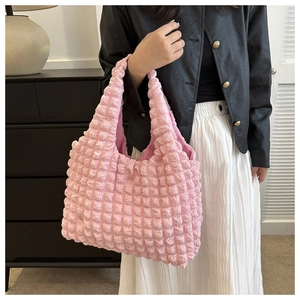 Close-up of pink bubble texture tote bag with dense 3D popcorn pattern and soft fabric