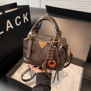 Retro dark brown oil wax leather Boston bag with charm and adjustable strap for women