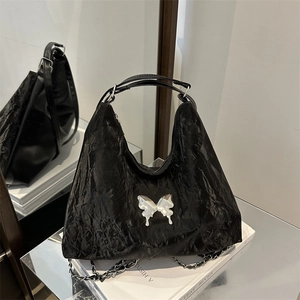 Versatile black wrinkled shoulder bag with silver butterfly and metal chain strap
