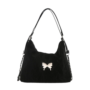 Black pleated crossbody bag with silver butterfly charm and adjustable shoulder strap