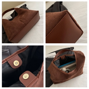 Dettaglio borsa tote in pelle scamosciata marrone con fibbia magnetica e interno capiente