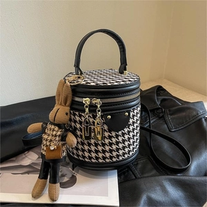 Chic houndstooth cylinder bucket bag with black PU leather trim and bunny charm