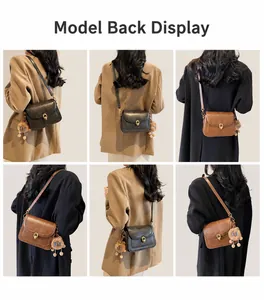 Detailed view of the vintage leather shoulder bags with gold ring locks and plush bear charms