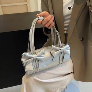 Silver metallic cylinder bag with double bows and sleek shoulder straps for women