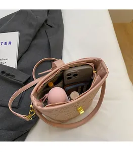 Top view of pink bucket bag showing large capacity for phone, umbrella and makeup
