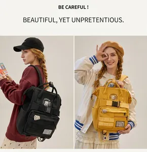 Detail view of durable school backpacks in black and yellow with multi-pocket design