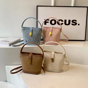 Fashionable bucket shoulder bags in four colors with cute cartoon prints and long straps