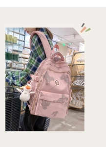 Pink printed backpack with grey bear pattern and cute white duck charm detail