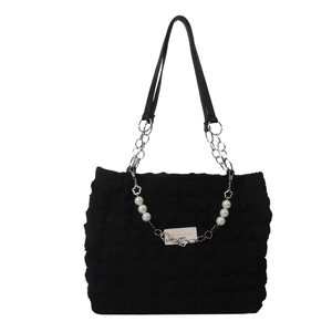 Large black quilted puff tote bag with silver chain and floral pearl charm