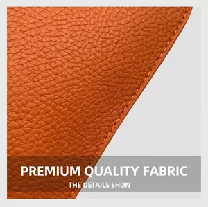 Macro detail of brown lychee grain leather with precise stitching for heart-shaped handbag