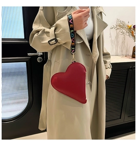 Red heart-shaped leather pouch with litchi texture and printed LOVE wrist strap