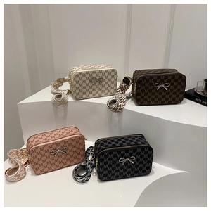 Detailed display of four rectangular camera bags in beige, brown, pink, and black colors