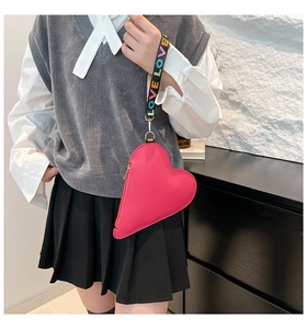 Pink heart-shaped pouch with lychee leather texture and colorful LOVE letter lanyard