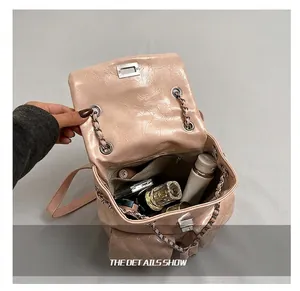 Detailed view of the quilted pink backpack interior showing spacious storage capacity