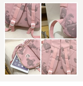 Detailed view of pink printed backpack with reinforced straps and tablet compartment
