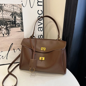 Brown vintage leather handbag with gold hardware and dual-use straps for women