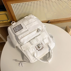 White minimalist Japanese style multi-pocket backpack for students with bread embroidery