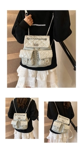 Detailed view of silver quilted backpack with chain straps and two front flap pockets