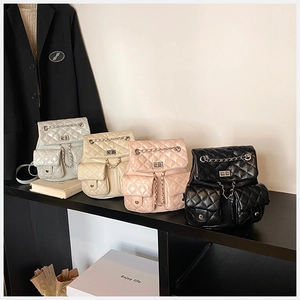 Quilted mini backpacks in four colors with chain straps and metallic turn-lock closures
