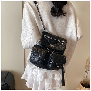 Quilted black leather backpack with chain straps and dual front pockets detail