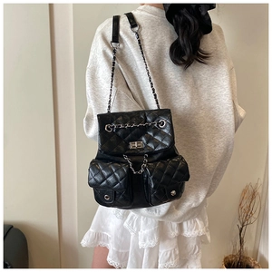 Quilted black leather backpack with silver chain straps and dual front pockets