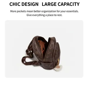 Spacious interior of brown bear print backpack showing main compartment and zipper pocket