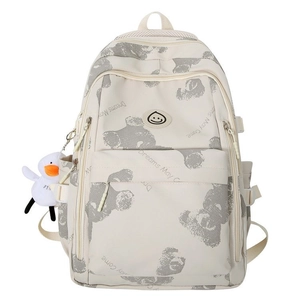 Beige printed backpack with bear patterns and cute duck pendant for school travel