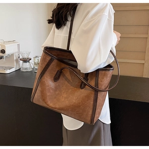 Vintage brown large capacity tote bag made of PU leather shown in a lifestyle scene