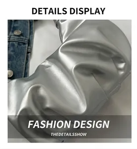 Detail shot of silver pleated metallic bag showing soft PU leather texture and puff design