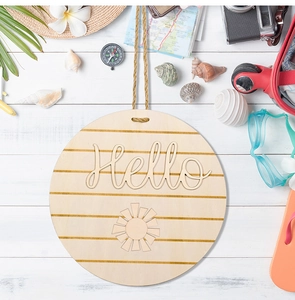 Detail of round wooden door sign with Hello carving and summer travel decor