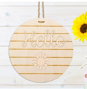 Close-up of circular wooden door sign with Hello 3D lettering and rustic hemp rope hanger