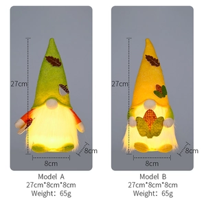 Detail of harvest gnomes with warm LED lights, autumn leaves and corn decorations