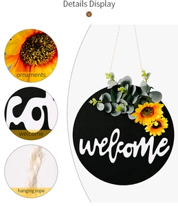 Detail view showing sunflower ornaments and rustic welcome sign on a round wooden plaque
