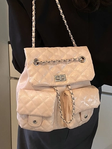 Quilted faux leather backpack with diamond stitching and silver chain straps in beige